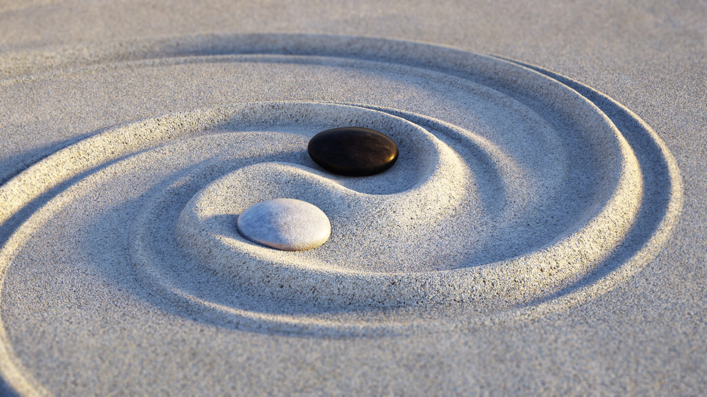 Yin Yang Motive made of stones and lines in the sand - My Safe Space 4 All