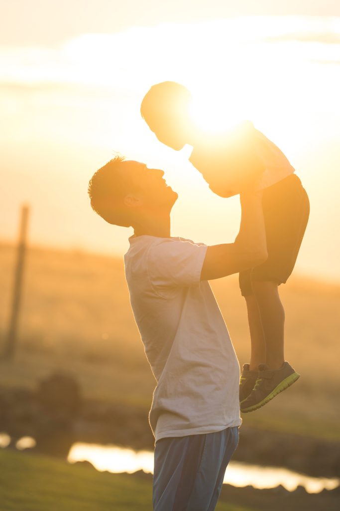 Dad holds his son up in the air - My Safe Space 4 All
