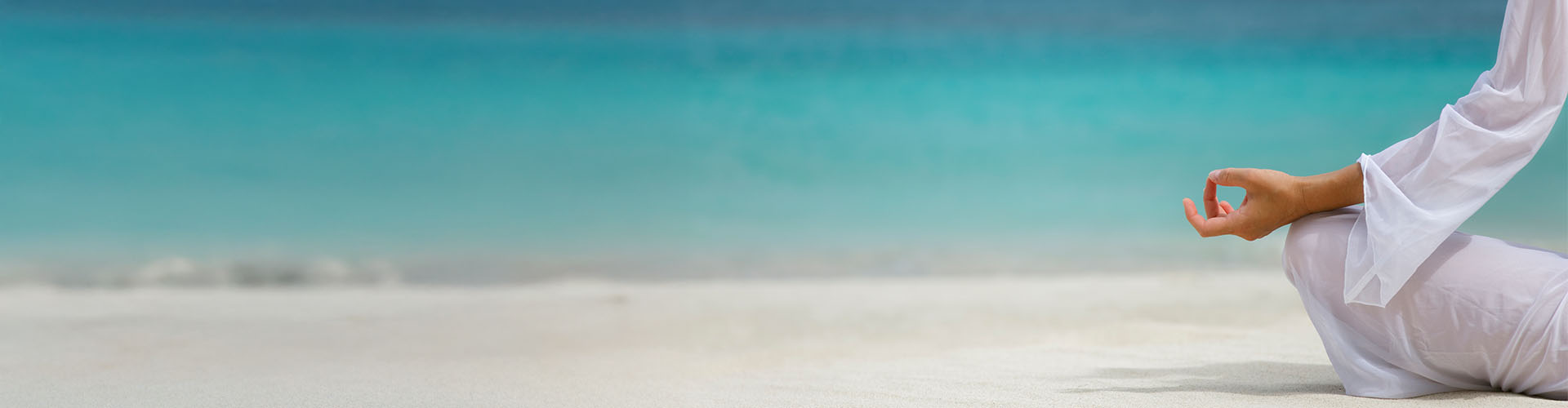 Woman meditating at beach