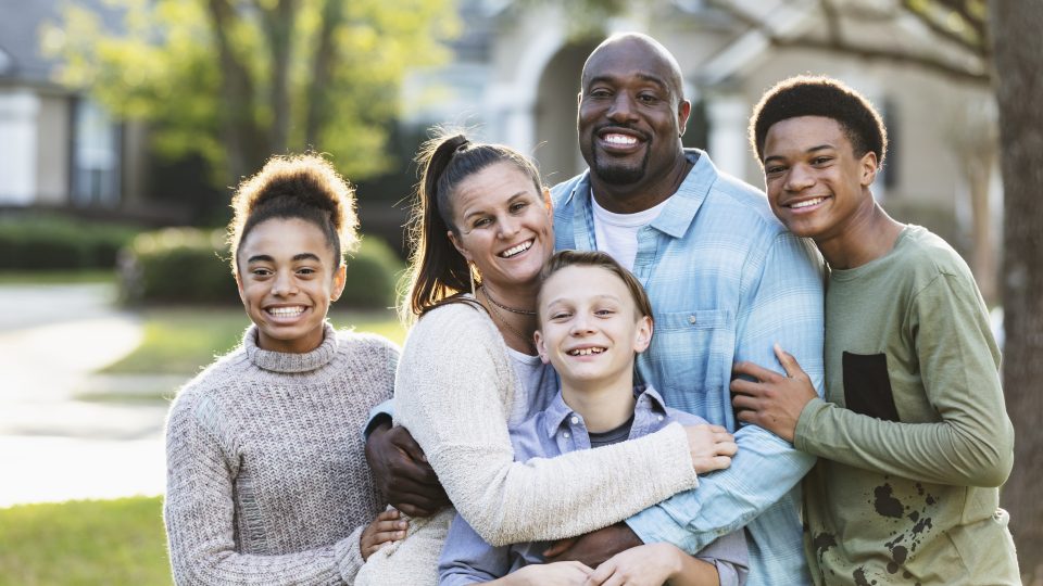 Portrait of blended multi-ethnic family three children